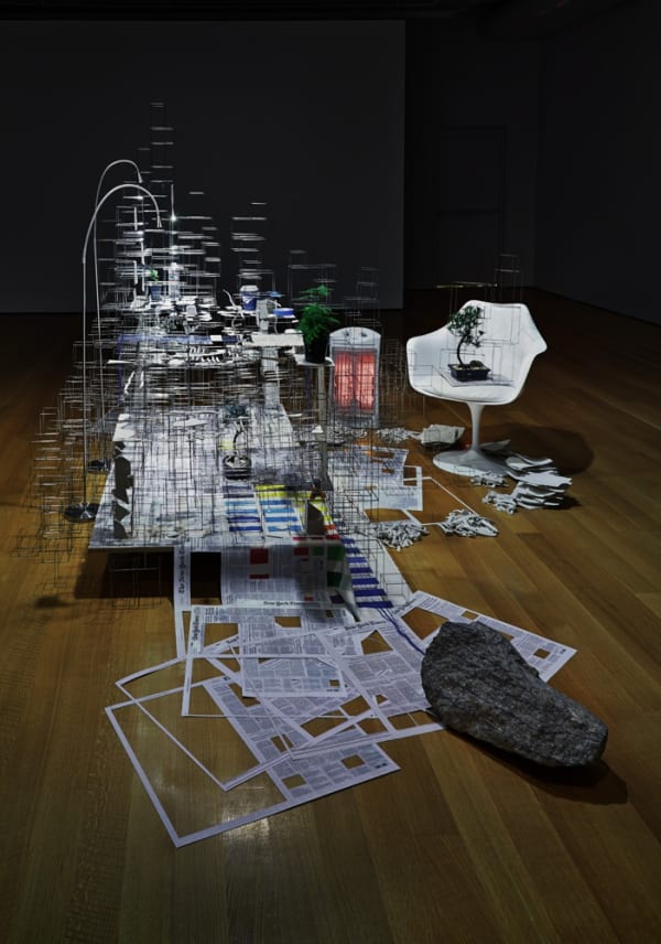 installation view in darkened room of sculpture