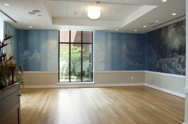installation view of Cinto wall painting blue shades and wave drawings