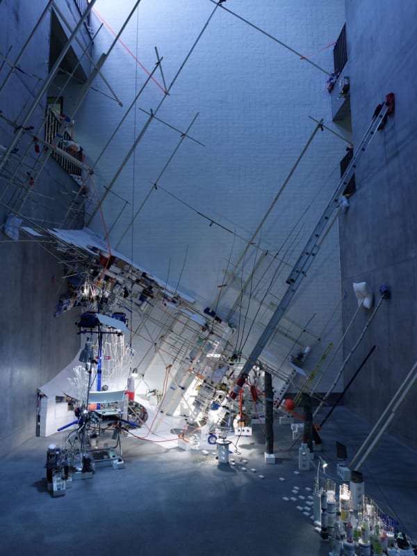 Image of a multi-story installation with ladders and objects