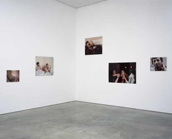 Image of an installation view of Phil Collins photographs