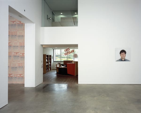 Image of an installation view of Phil Collins photographs