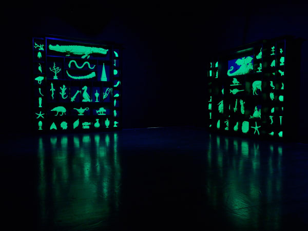 image of Mark Dion sculptures glowing in the dark