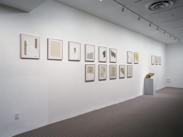 image of installation with cabinet and sculptures at MoMA