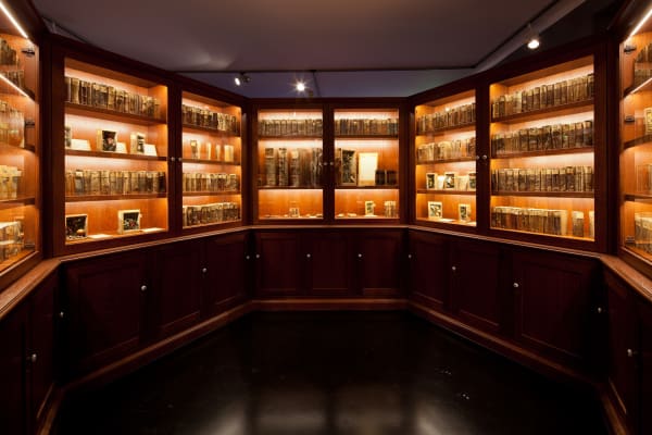 Image of Mark Dion installation, large circular bookcase cabinet