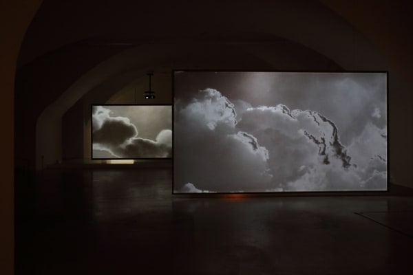 Installation image of Lisa Oppenheim cloud projections