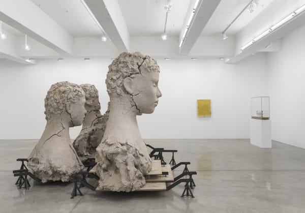 Manders large sculpture installation of four heads