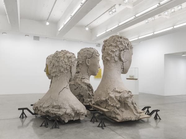 Manders large sculpture installation of four heads