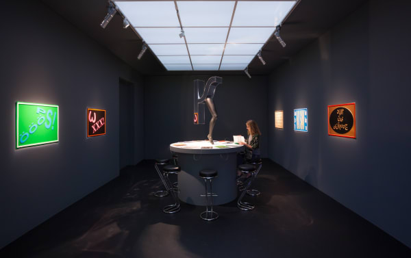 Image of installation view of Slavs and Tatars, table and vacuum wall works