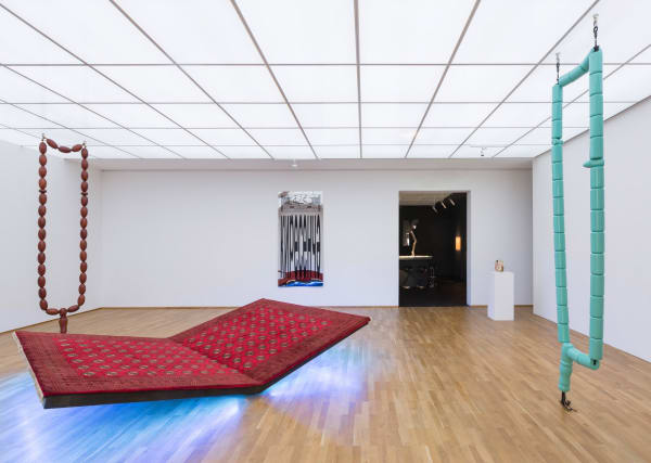 Image of installation view of Slavs and Tatars, carpet bench