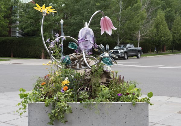 Image of Kelly Akashi bronze hand sculpture, view from the back with flowers
