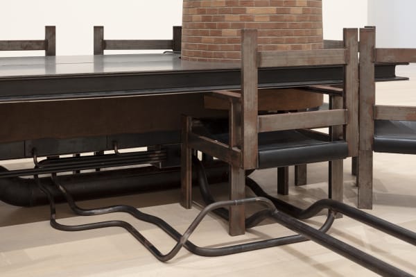 Image of Mark Manders installation, factory with clay figure and chair