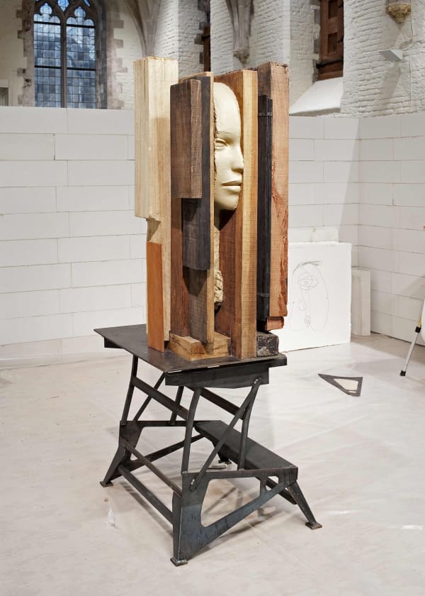 image of mark manders sculptures and studio set up inside a concrete room block
