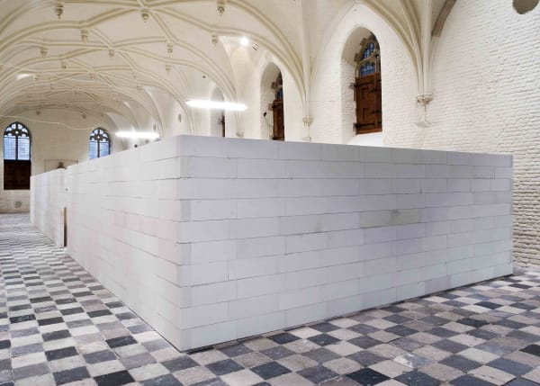 image of mark manders sculptures inside a concrete room block