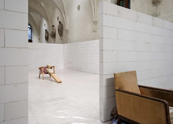 image of mark manders sculptures inside a concrete room block