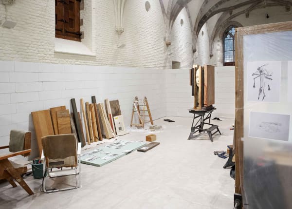 image of mark manders sculptures and studio set up inside a concrete room block