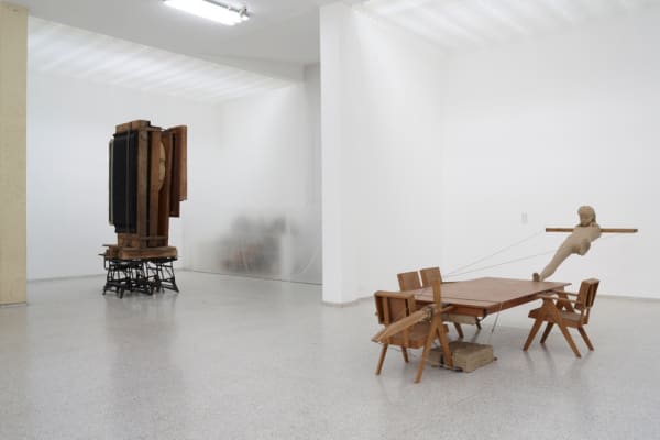 image of Mark Manders tables and chairs with clay figure at Venice Biennale