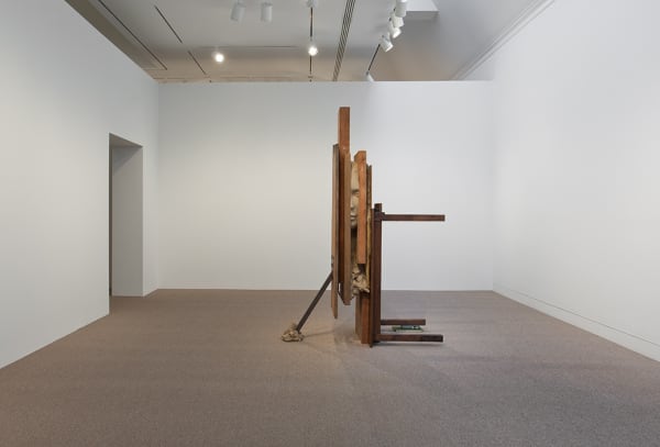 Image of Mark Manders sculpture large clay head between wood panels