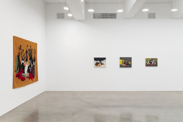 installation view of tapestries and paintings