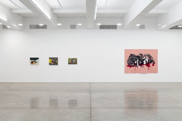 installation view of tapestries and paintings