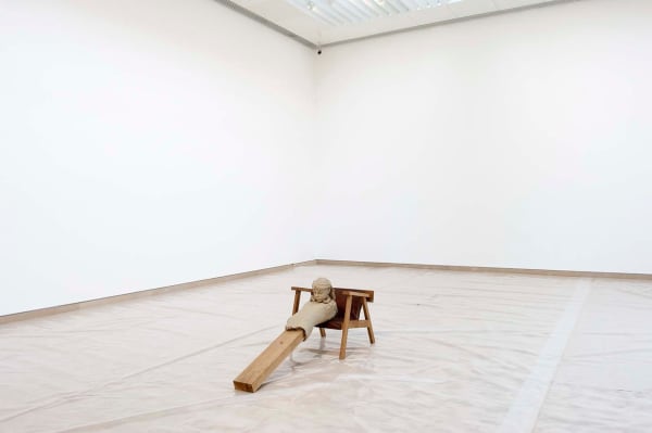 image of Mark Manders figure in chair sculpture