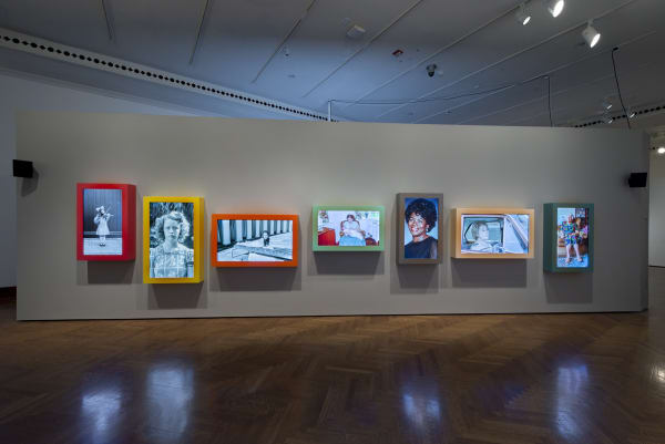 Image of Wearing installation, moving photographs in a row