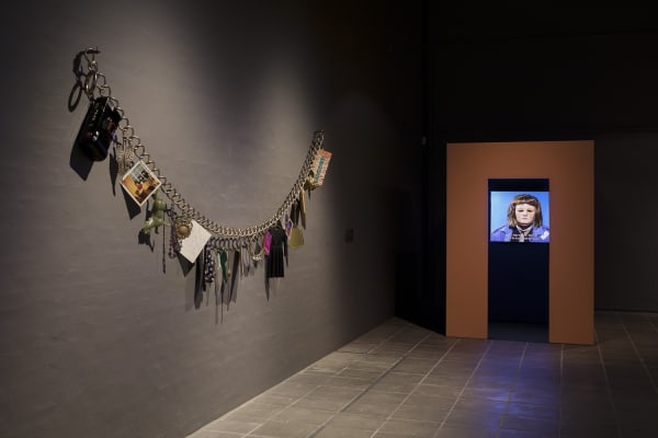 image of Gillian Wearing sculpture - enlarged necklace on wall