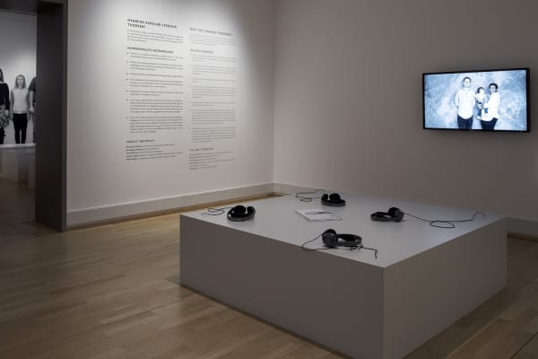 image of Gillian Wearing video installation with headphones