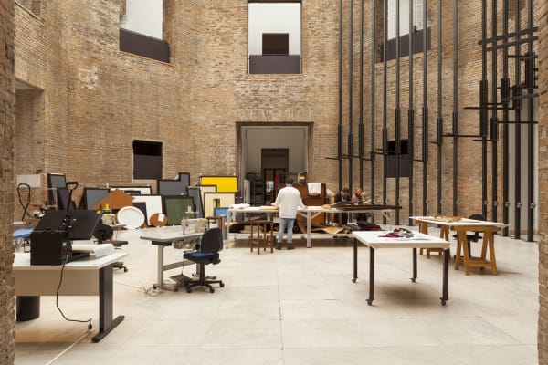 image of tailors sewing / working in a tailor shop set up inside museum