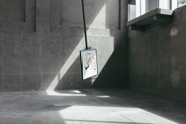 image of a large pendulum with a drawing on it