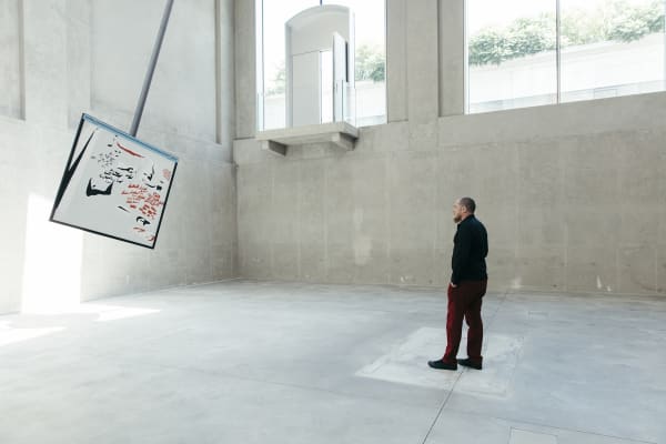 image of a large pendulum with a drawing on it