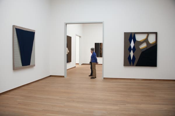image of fabric paintings hanging on walls