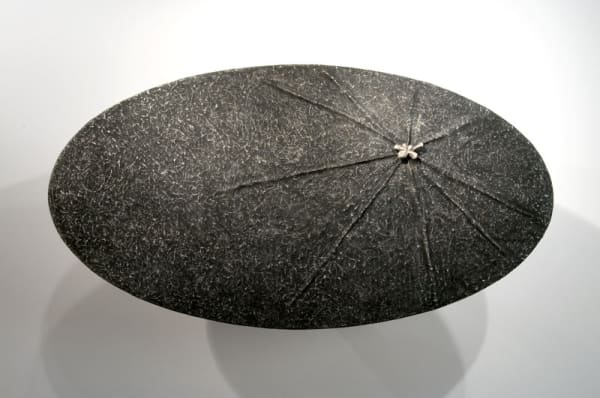 image of table-like sculpture mounted on wall