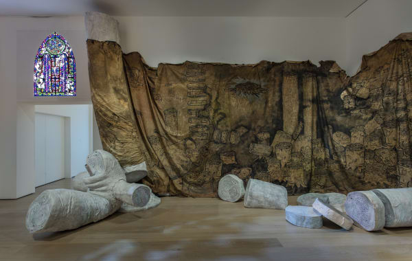 image Charles Long sculptural installation in darkened gallery space, large scroll with tree drawings
