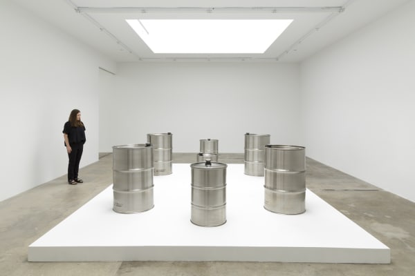 image of steel barrels on white pedestal