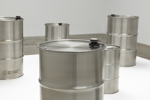 image of steel barrels on white pedestal