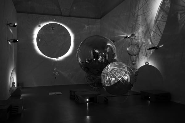 image of sculptures in dark room with shadows
