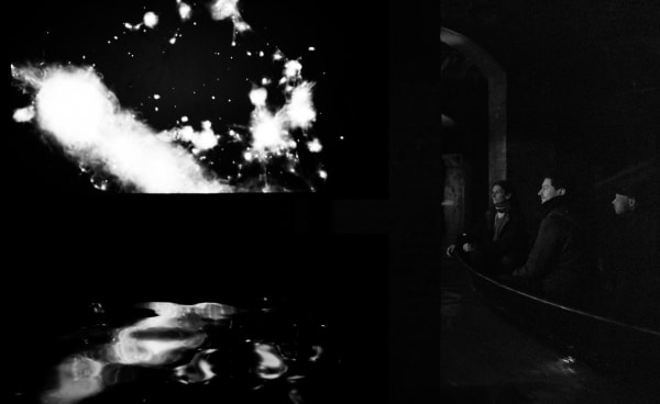 image of Saraceno sculptures hanging in dark room over water