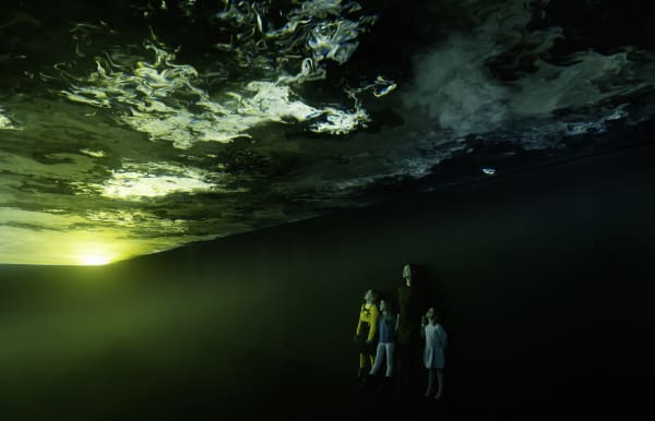 image of ceiling lit up with cloud like formations