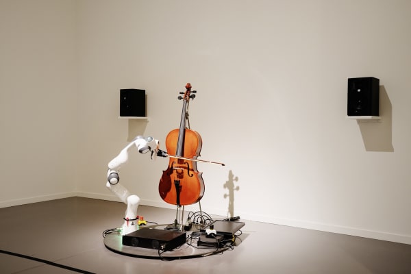 image of cello being played by a robot