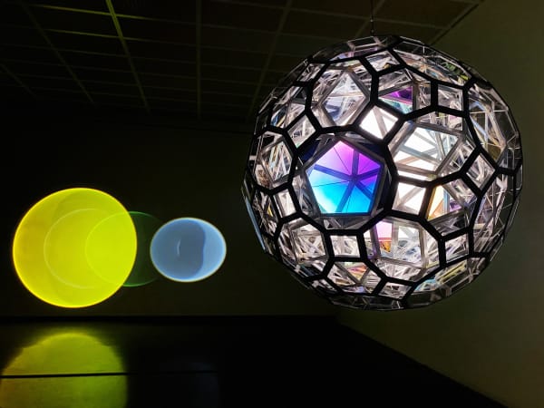 image of large hanging sphere and lights