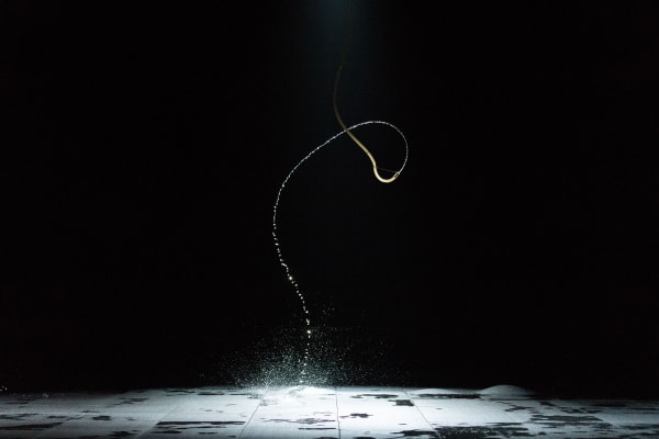 image of a water jet in dark room
