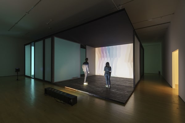 room with lights creating shadows of people