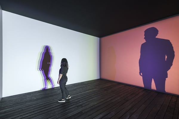 room with lights creating shadows of people