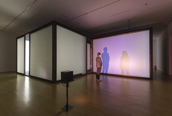 room with lights creating shadows of people