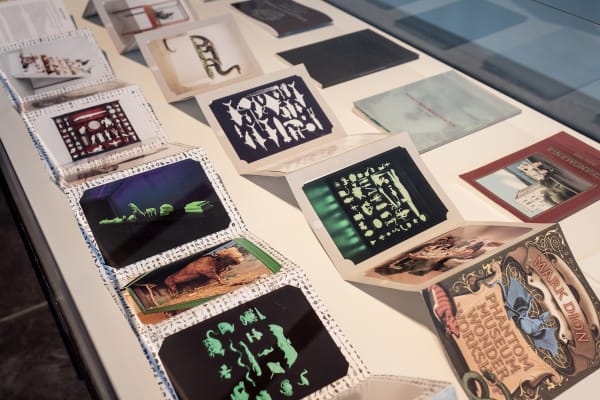 Image of papers and drawings under glass