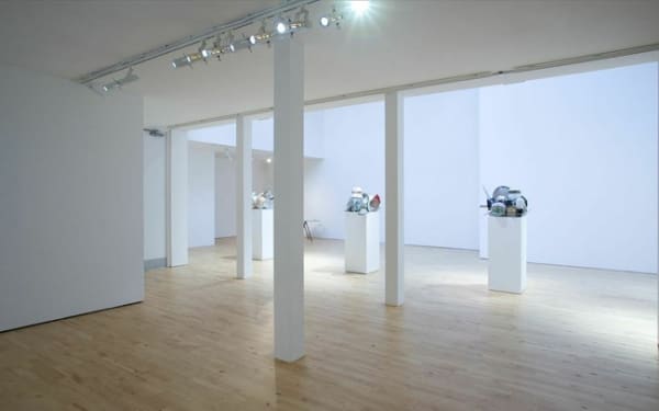image of a dish rack sculpture on pedestals