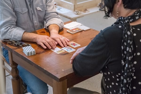 someone reading cards