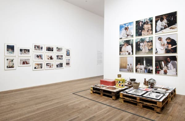 installation image of Meschac Gaba works at Tate, photographs on the wall