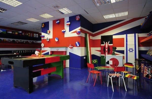image of room covered in different flags painted on everything