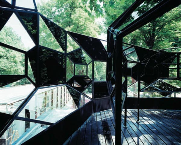 image of sculpture object on building with mirrors